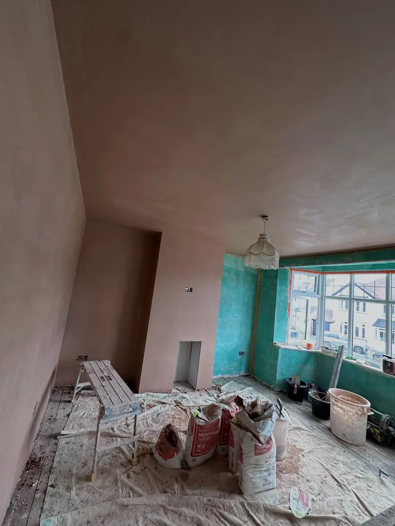 A Hornchurch room with fresh plaster and a squared-up bay window