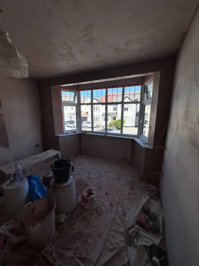 A bay-fronted room in Hornchurch freshly skimmed, with the window reveals squared up