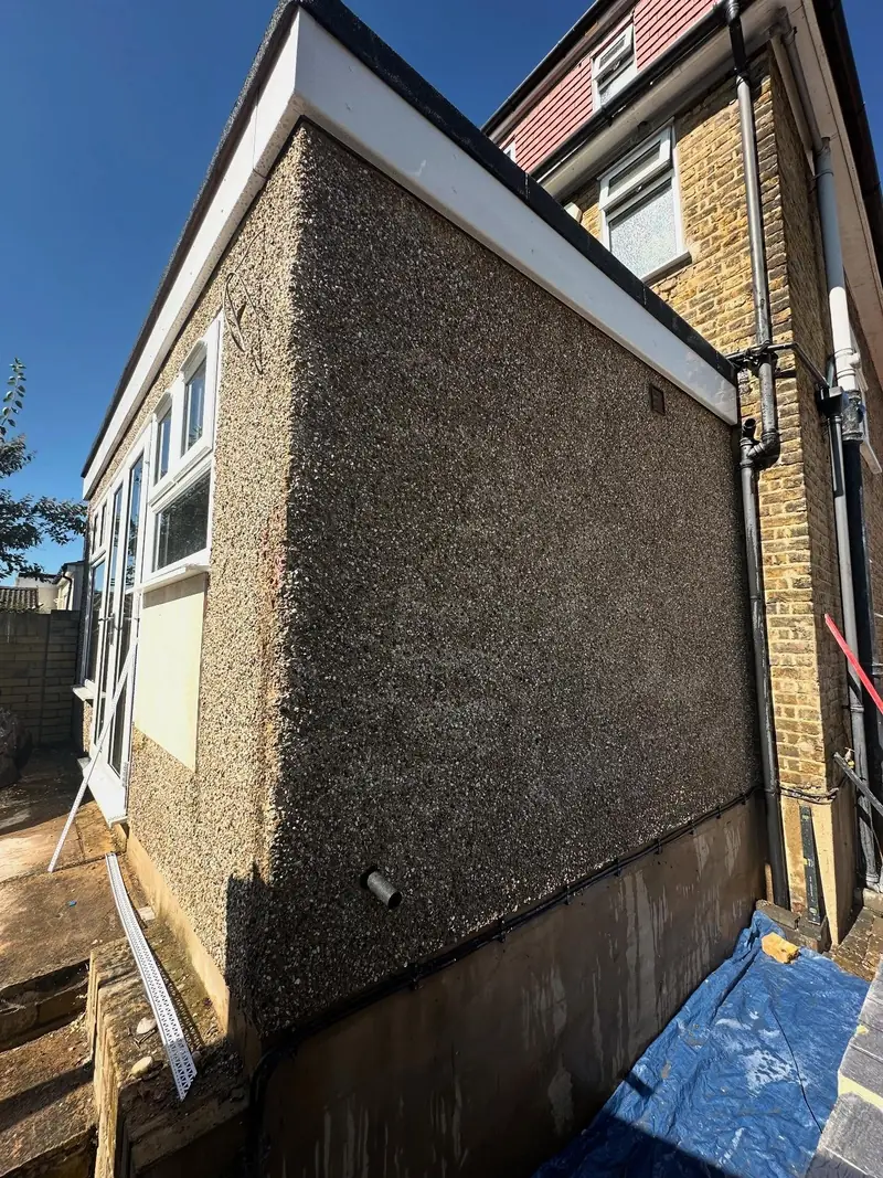A single-storey extension in Upminster covered in old pebbledash